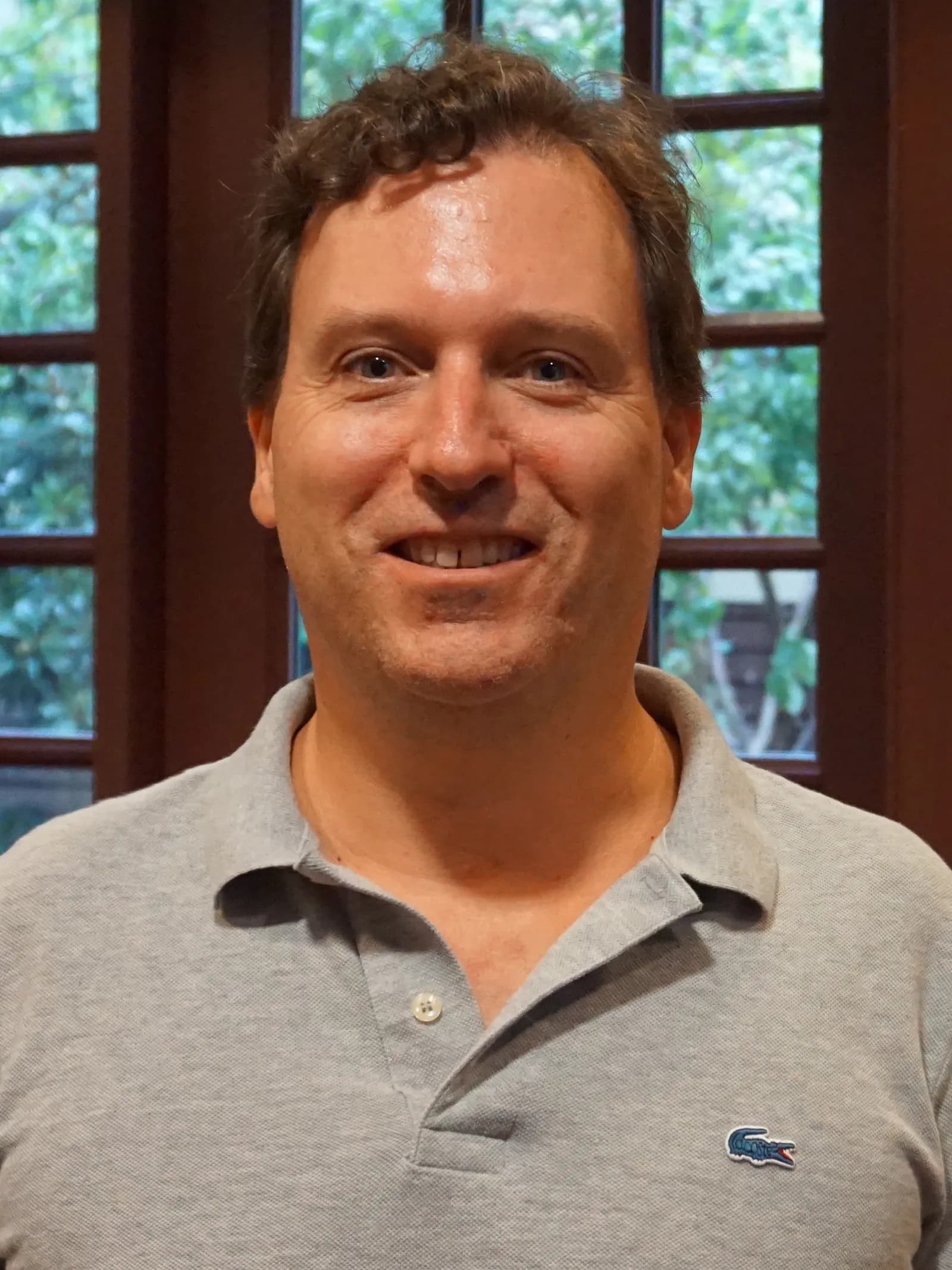 John Carreyrou, wearing a grey polo shirt, at a 2019 conversation event.