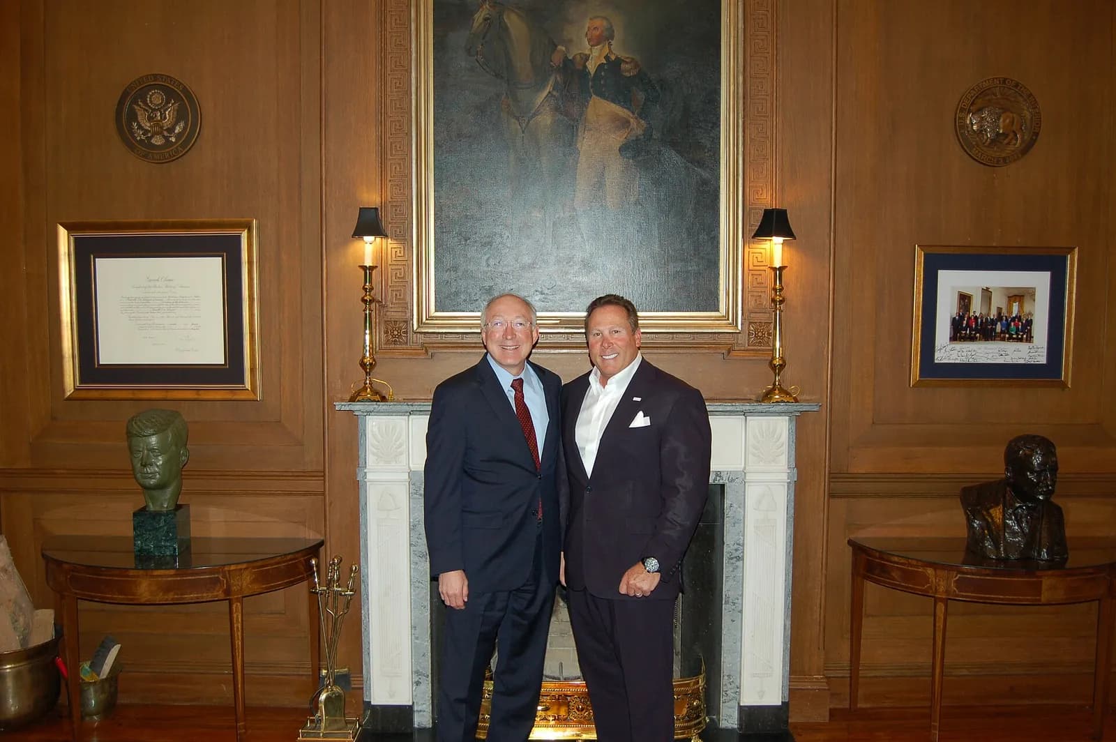 Stephen Cloobeck stands with Secretary Ken Salazar.