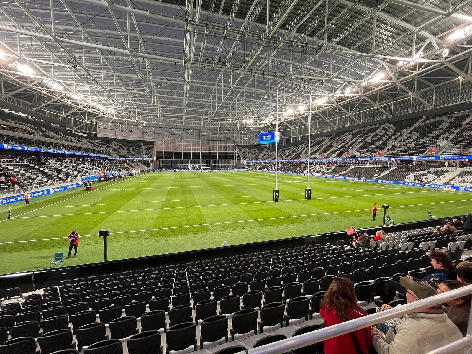 View across the interior of Te Kaha stadium from the South Stand before a rugby match.