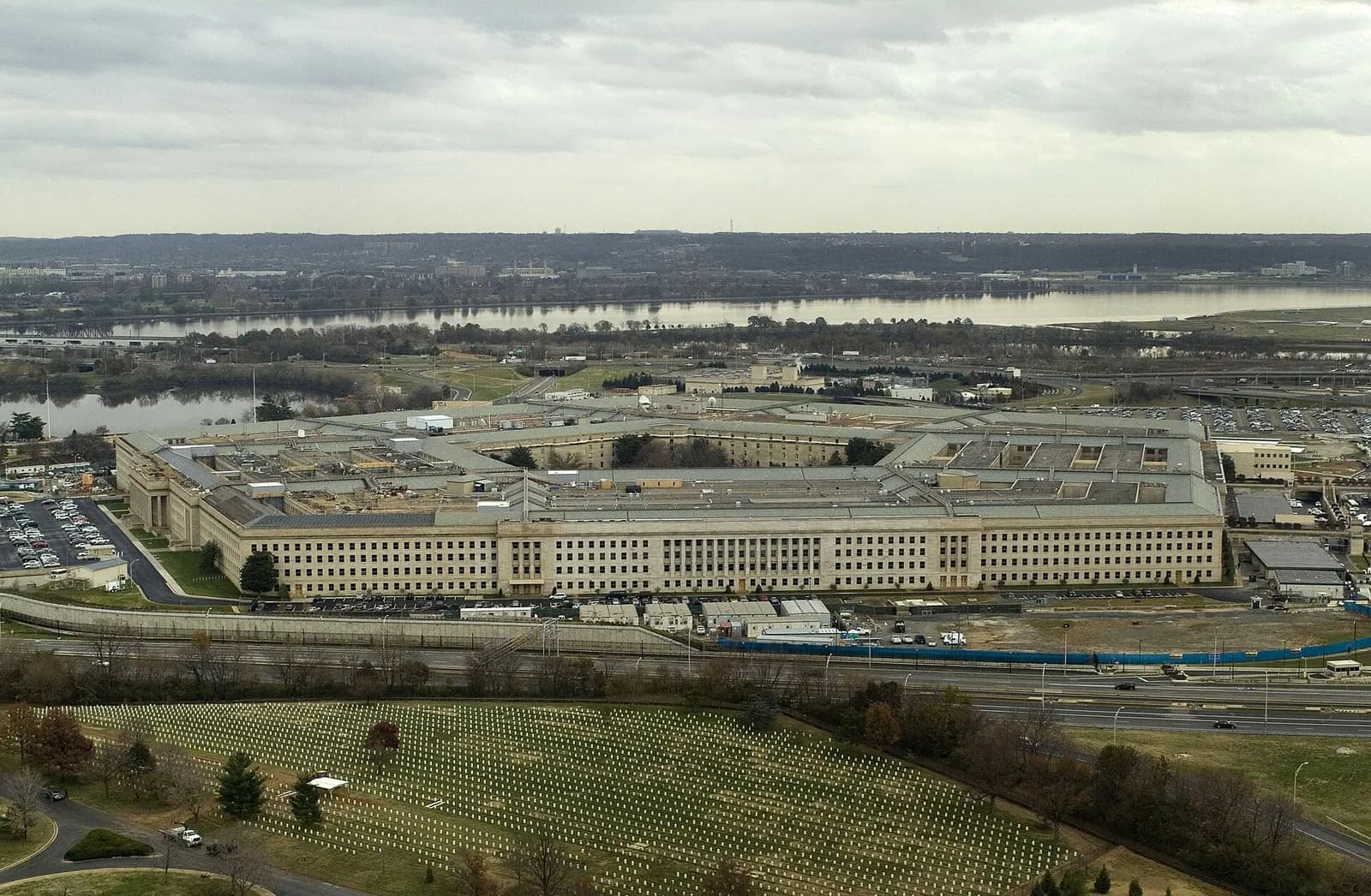 Aerial view of the Pentagon beside the Potomac River and Arlington National Cemetery.