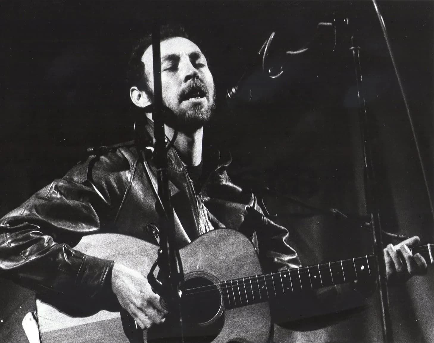 Richard Thompson performs on stage at Leeds Folk Festival in 1982.