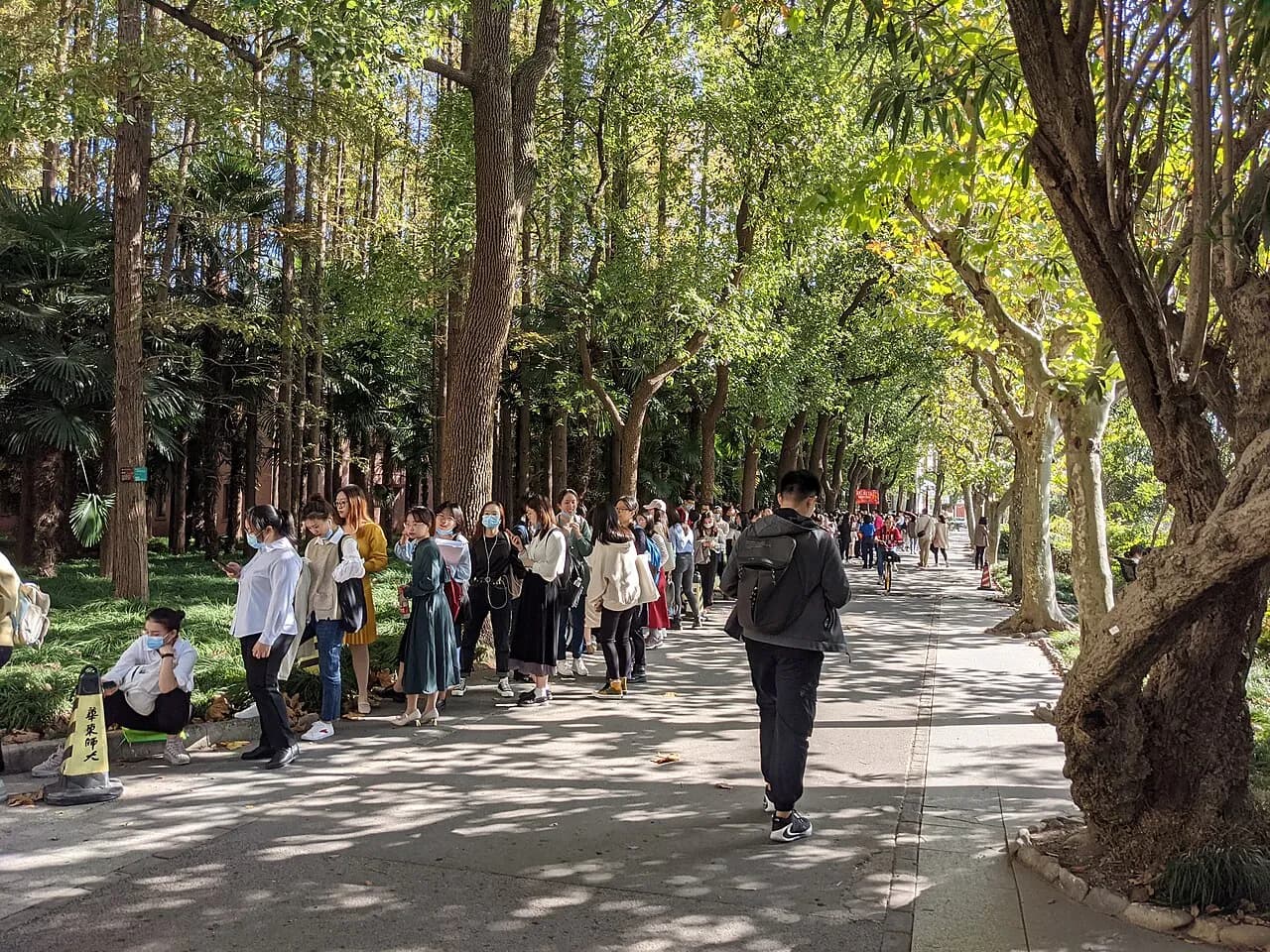 People queue outside a graduate recruitment fair at East China Normal University in 2020.