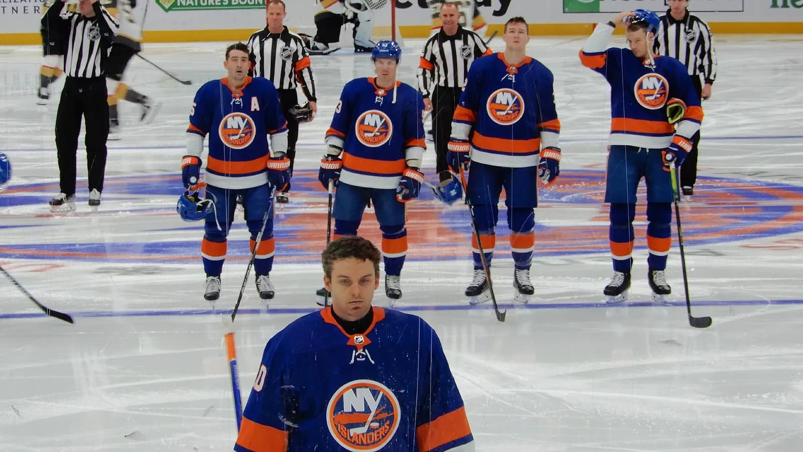 New York Islanders players lined up for the national anthem at UBS Arena.
