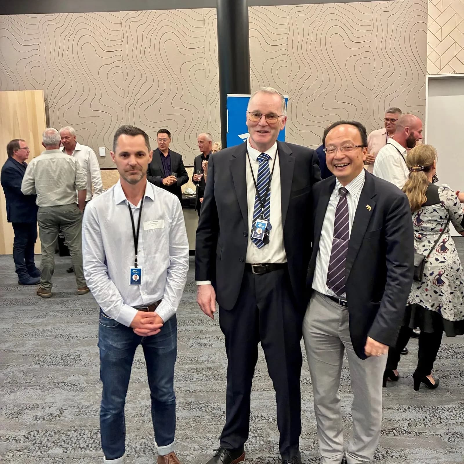 Ken Couper with two other men at a meeting in November 2025.