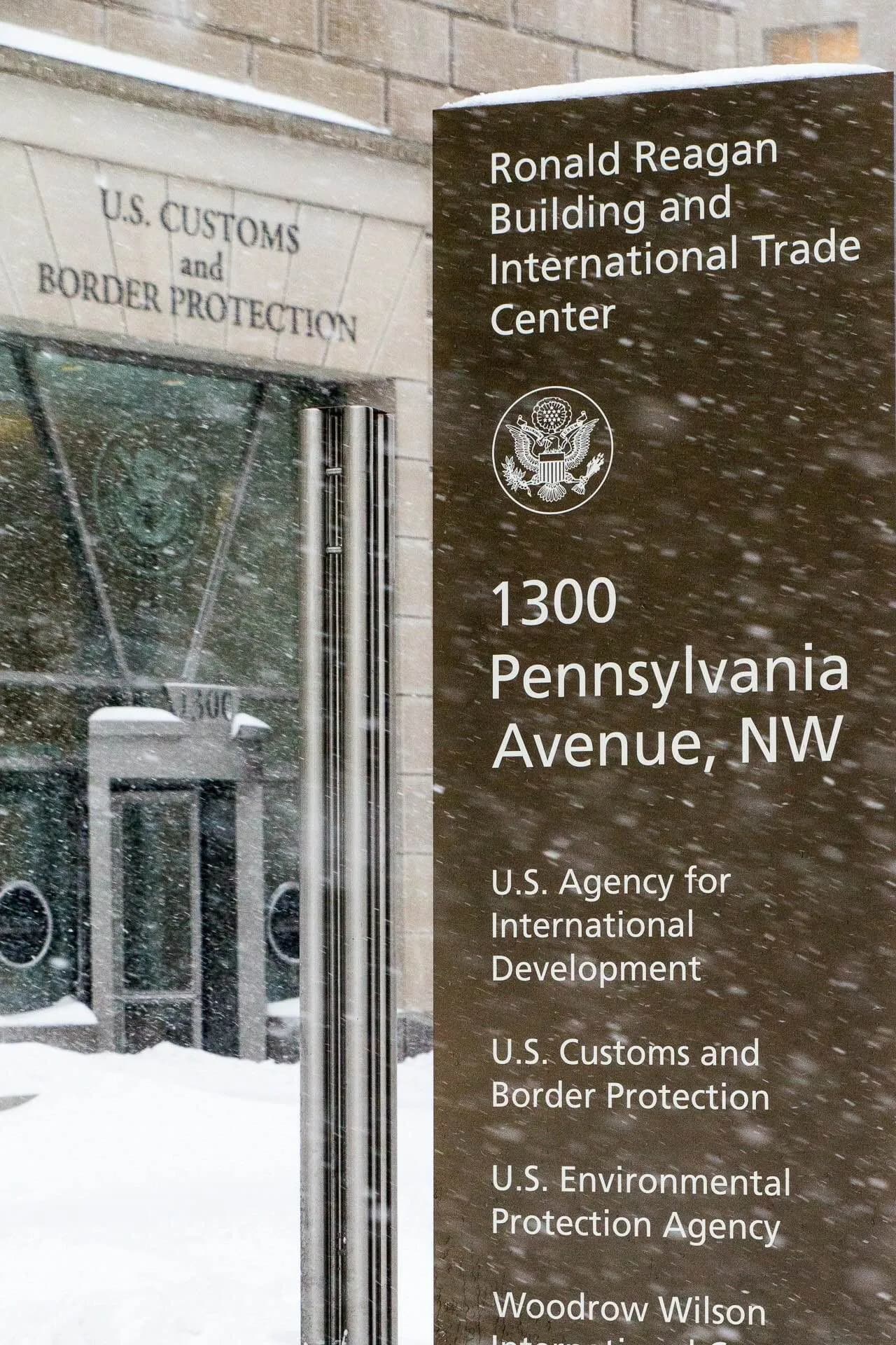 Entrance to U.S. Customs and Border Protection headquarters in Washington, D.C., amid snow.
