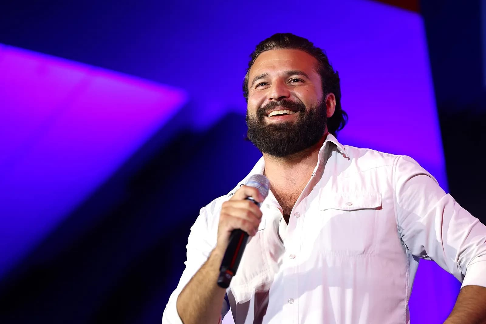 Brandon Herrera speaking at a convention.