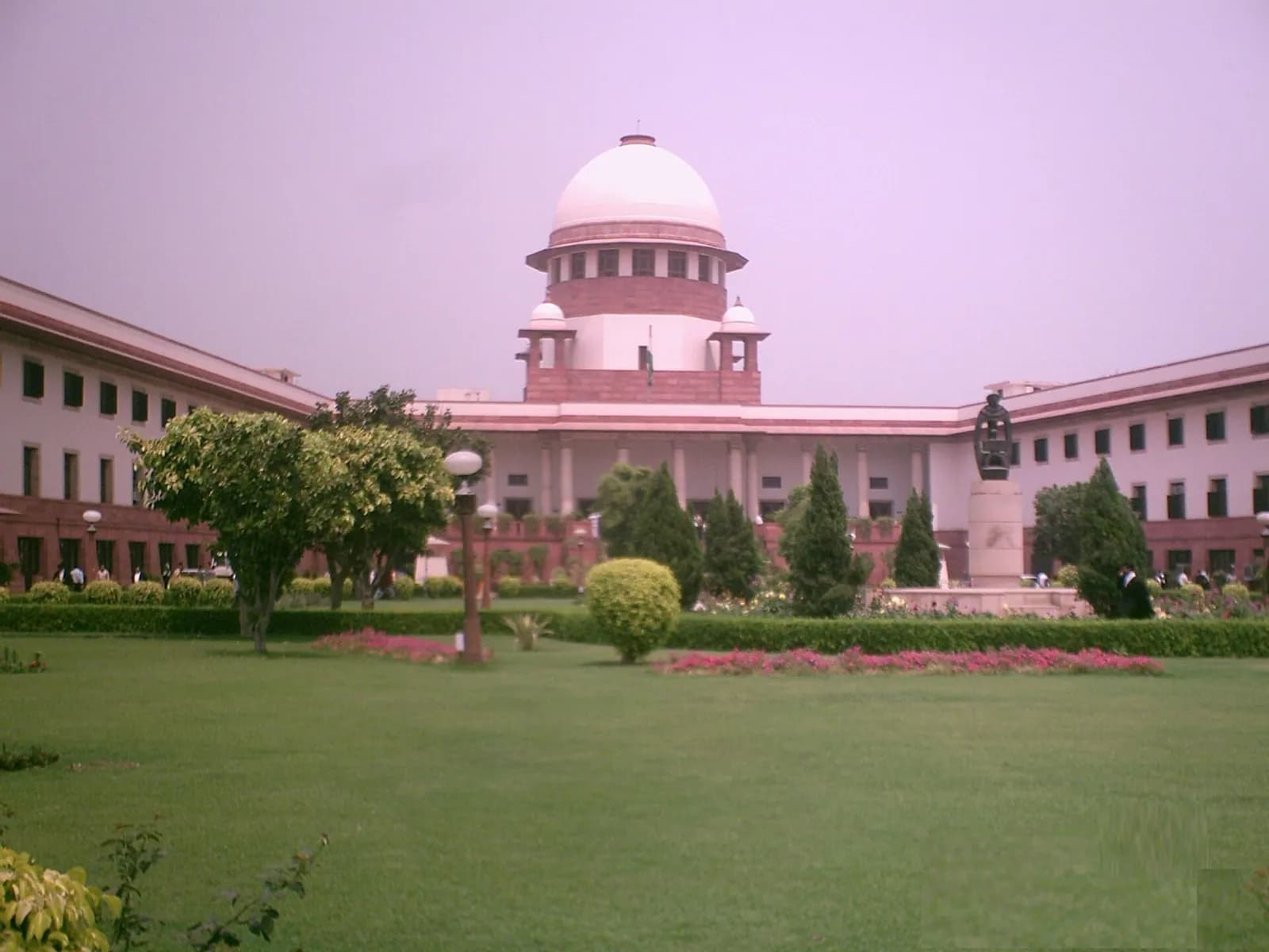 The Supreme Court of India building viewed from outside its perimeter wall.