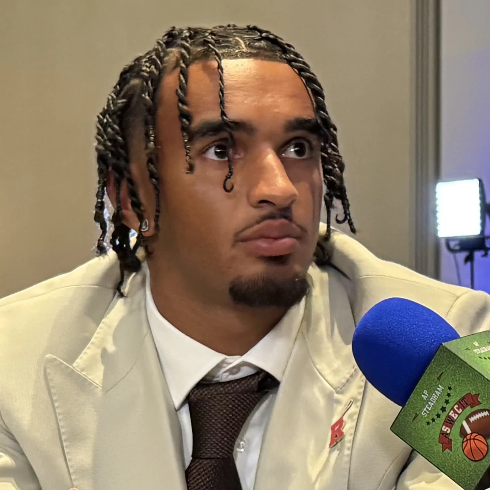 Rutgers wide receiver KJ Duff sits at a table with a microphone during Big Ten Football Media Days.