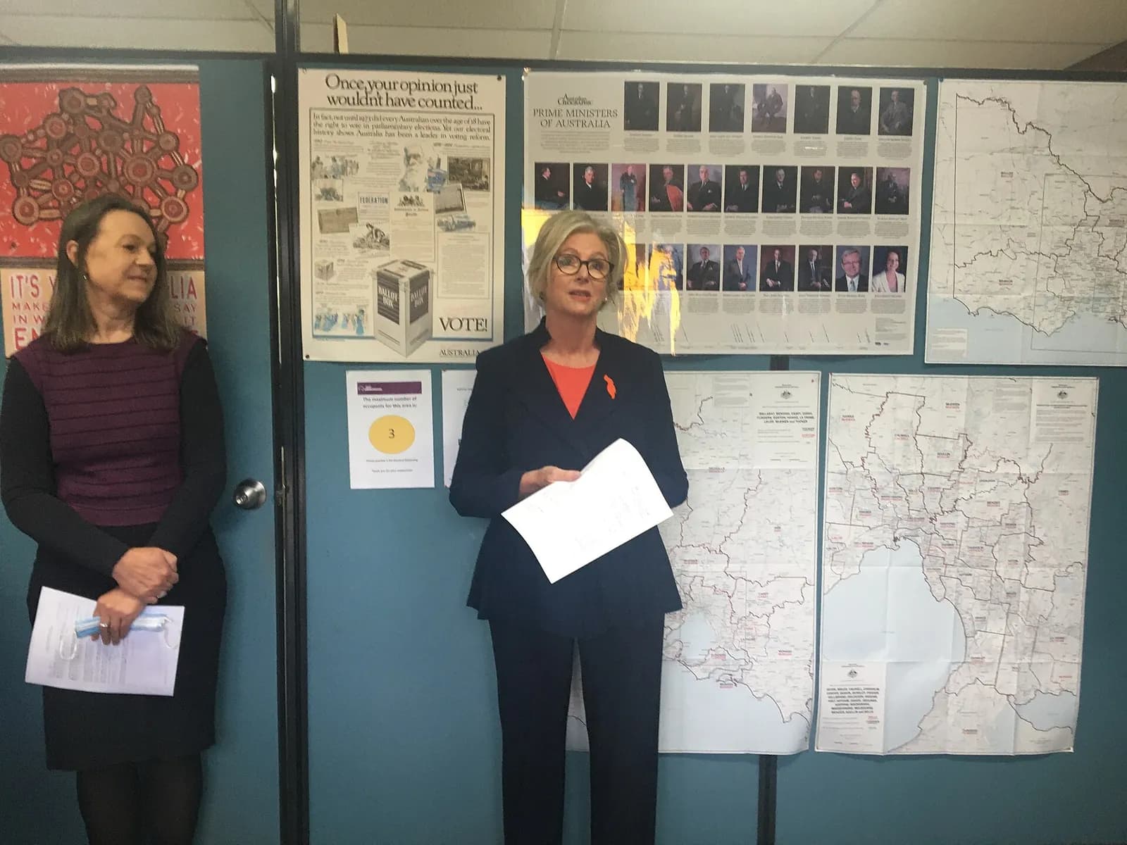 Helen Haines speaks at the declaration of results for the division of Indi, with the AEC returning officer beside her.