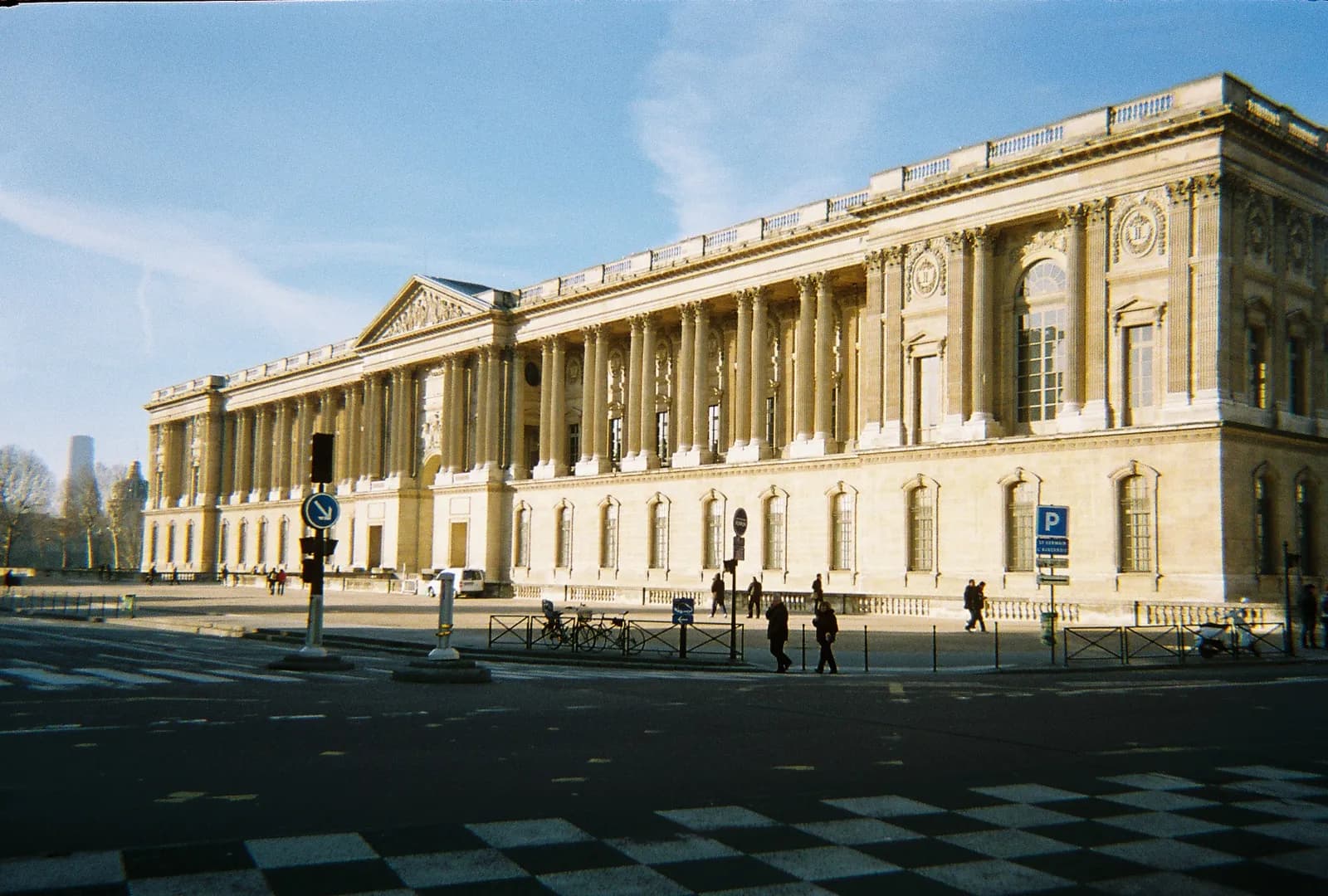 The eastern end of the Louvre in Paris, partly lit by sunlight.