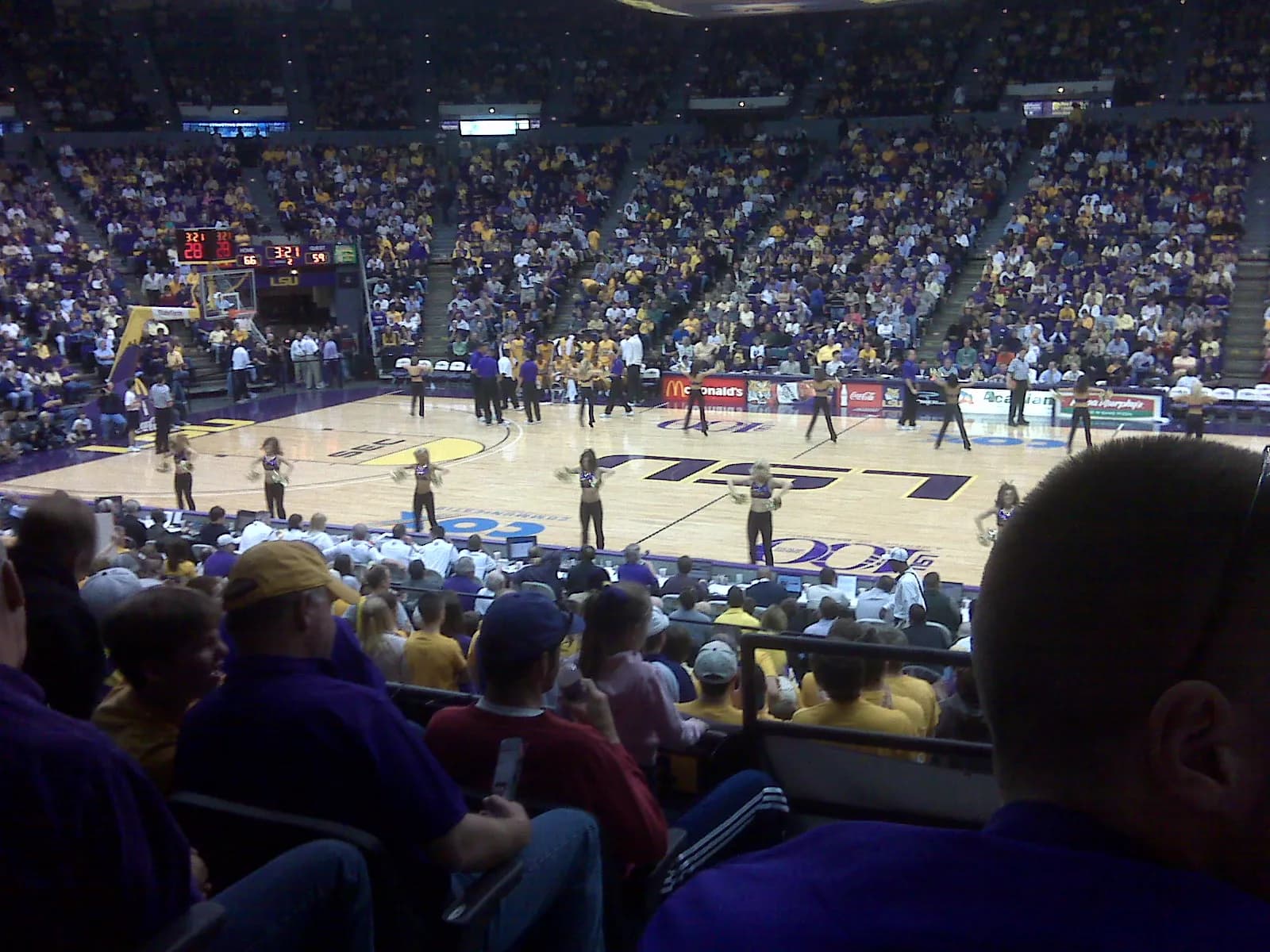 The court and interior of the Pete Maravich Assembly Center, with the LSU Tiger Girls dance team.