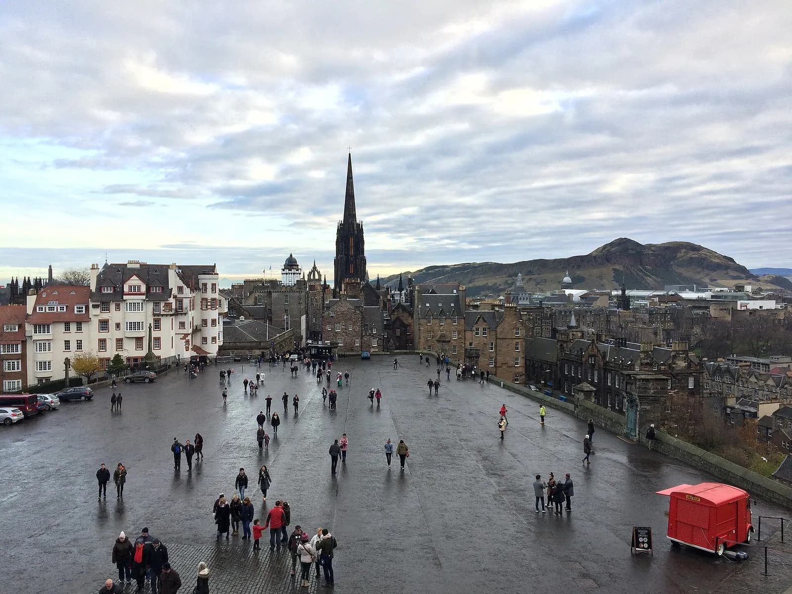 View across the Castle Esplanade, with Edinburgh rooftops and skyline beyond.