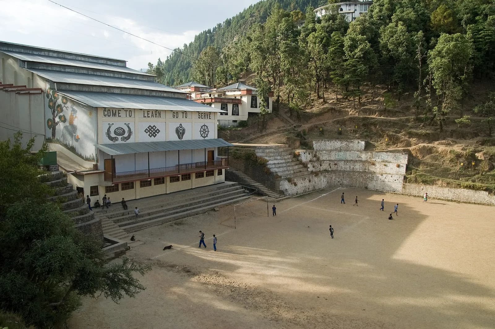 A Tibetan Children's Village campus and football field among the hills of Upper Dharamshala.