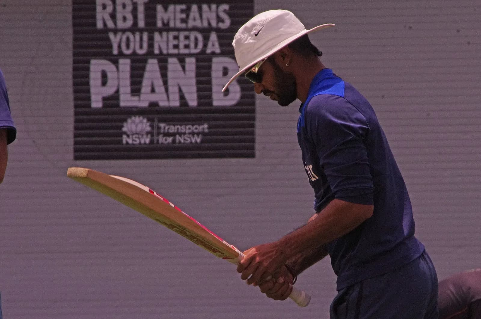 Shikhar Dhawan holding a cricket bat in 2015