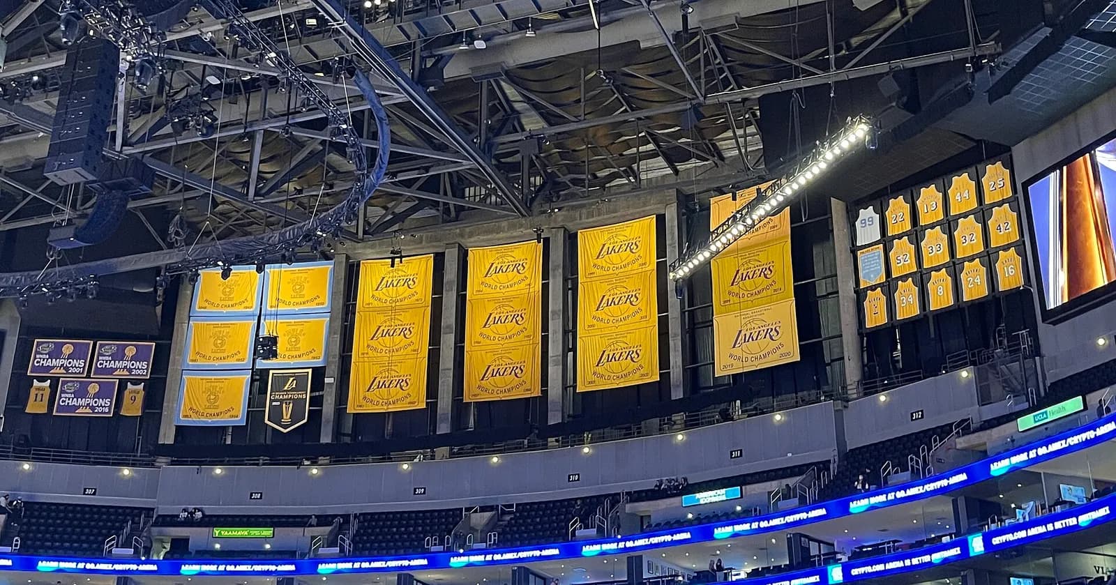 Los Angeles Lakers championship banners and retired jerseys hanging inside Crypto.com Arena.