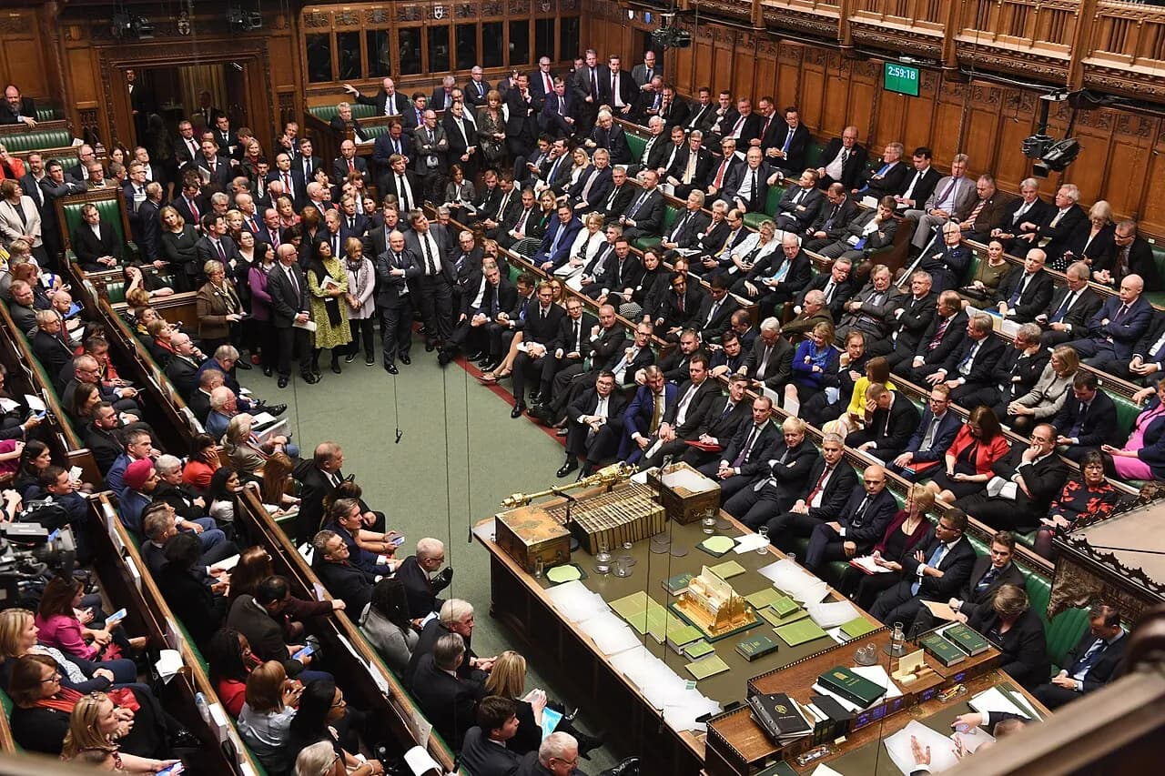 Members seated in the UK House of Commons chamber during a debate in 2019