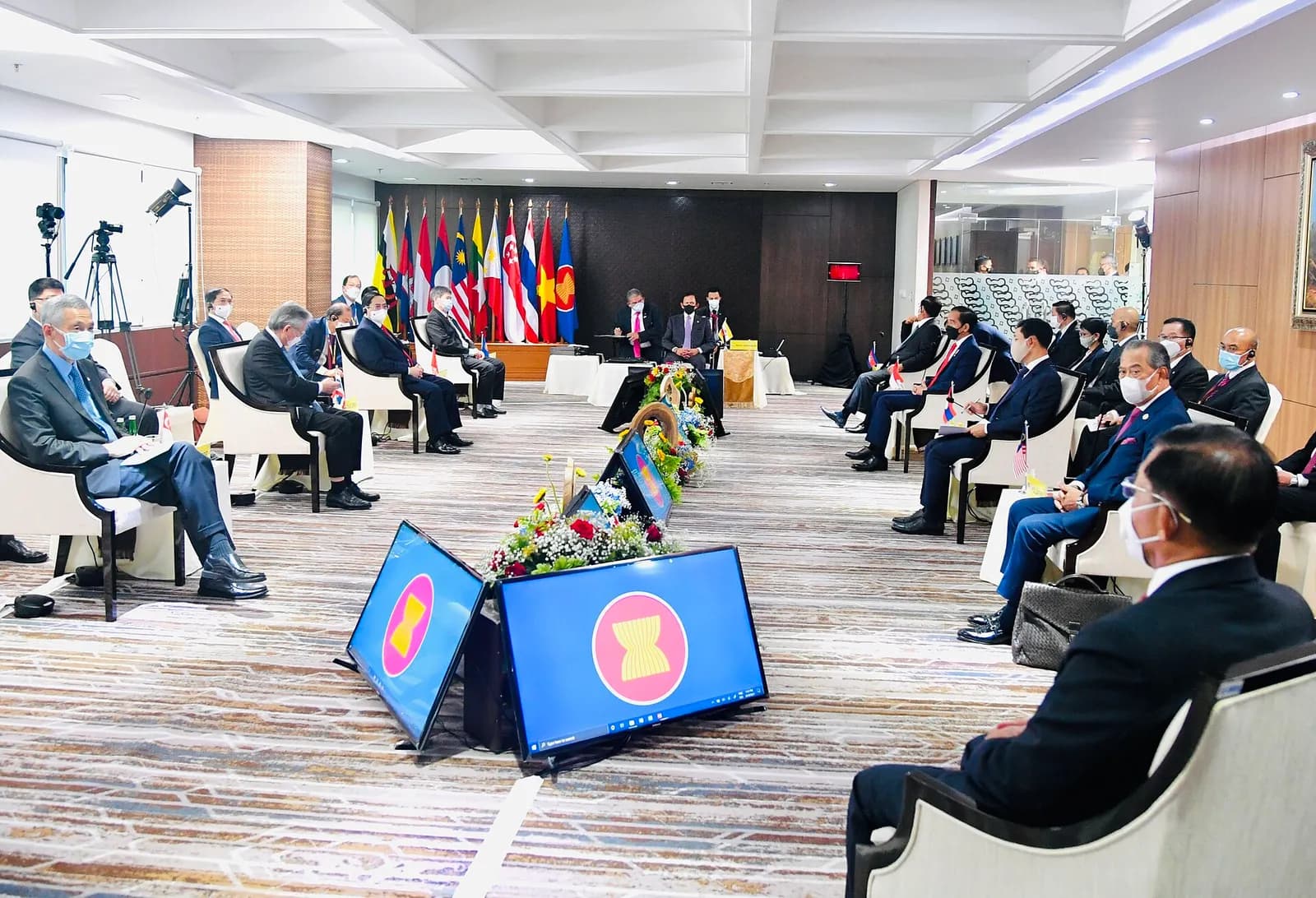 ASEAN leaders and representatives seated across from one another at a meeting table.