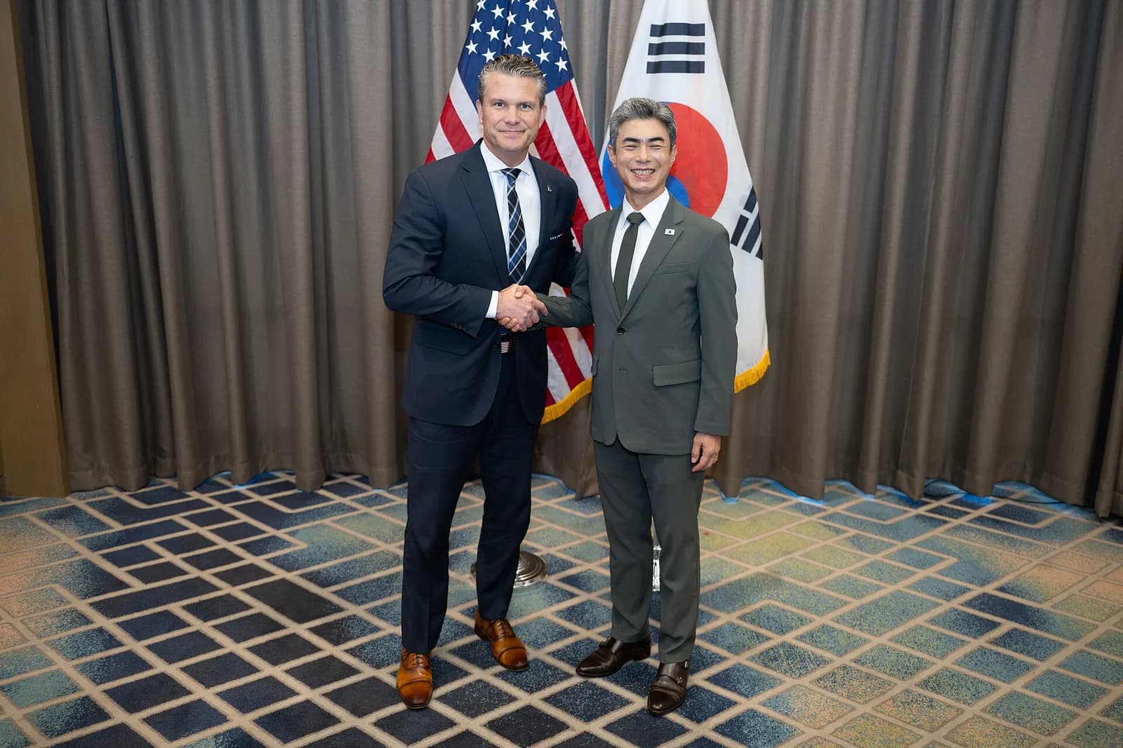 Pete Hegseth shakes hands with South Korean Defense Minister Kang Shin-chul at a defense ministers’ meeting.