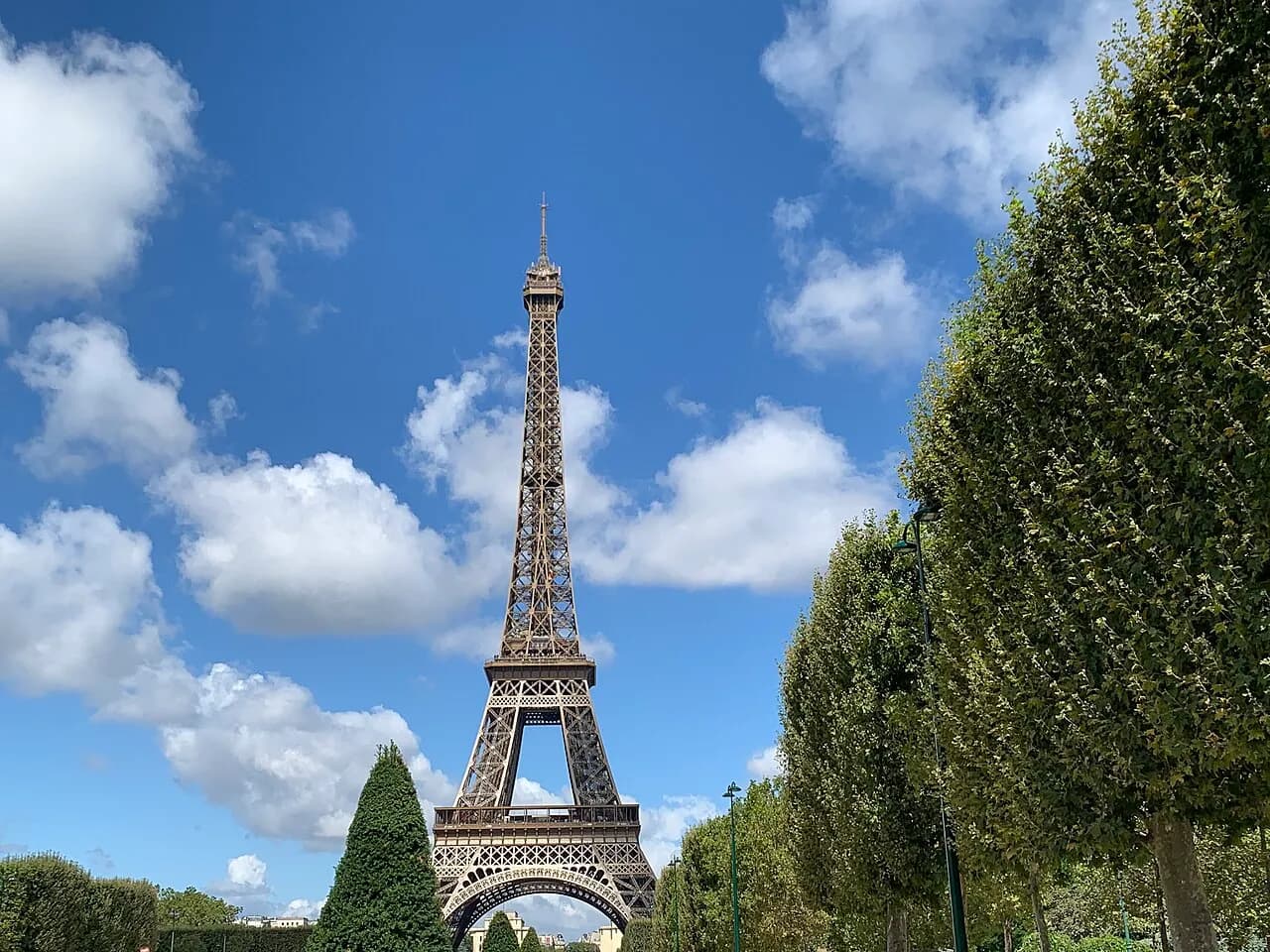 Daytime view of the Eiffel Tower from the Champ de Mars in Paris.