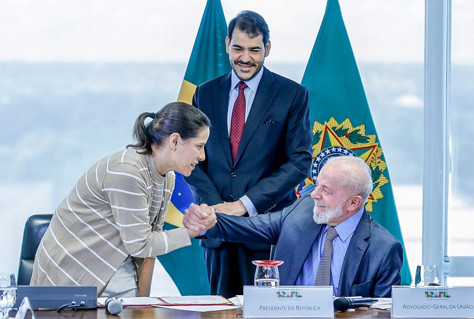 President Luiz Inácio Lula da Silva and Jorge Messias greet each other at a government meeting in Brasília.