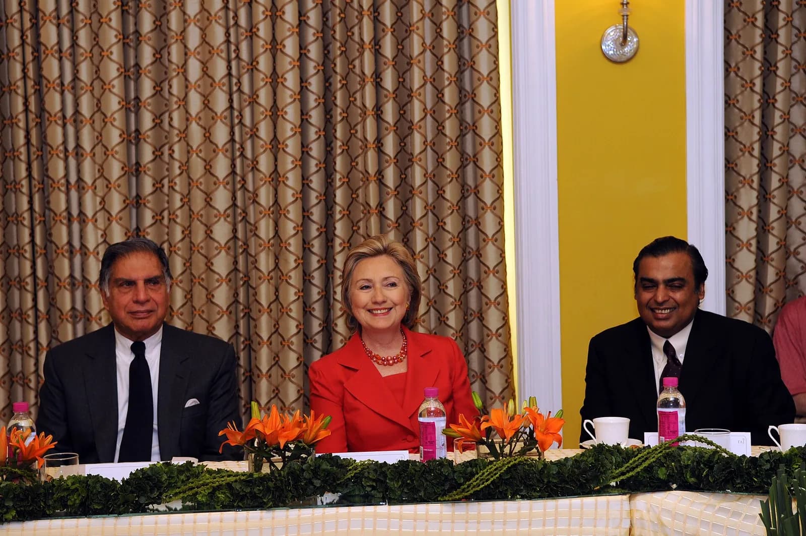 Mukesh Ambani sits with Hillary Clinton and Ratan Tata at a meeting with Indian business leaders.
