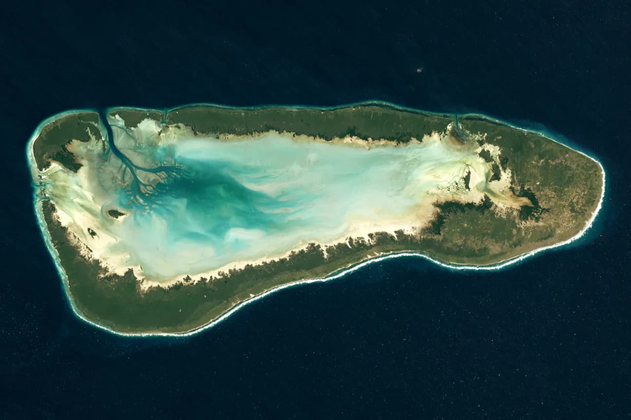 Satellite image of Aldabra Atoll’s coral islands and shallow lagoon.