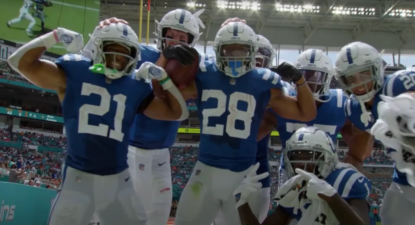 Jonathan Taylor celebrates with Indianapolis Colts teammates after a touchdown against the Miami Dolphins.