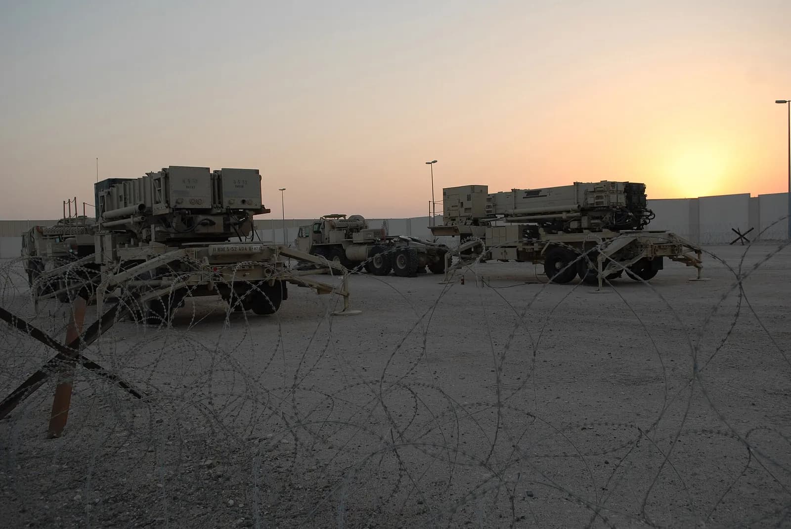 Patriot PAC-2 and PAC-3 missile launchers positioned at an air base.