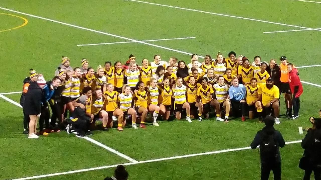 York Valkyrie and Papua New Guinea Orchids players pose together in a group photograph in York in 2022.