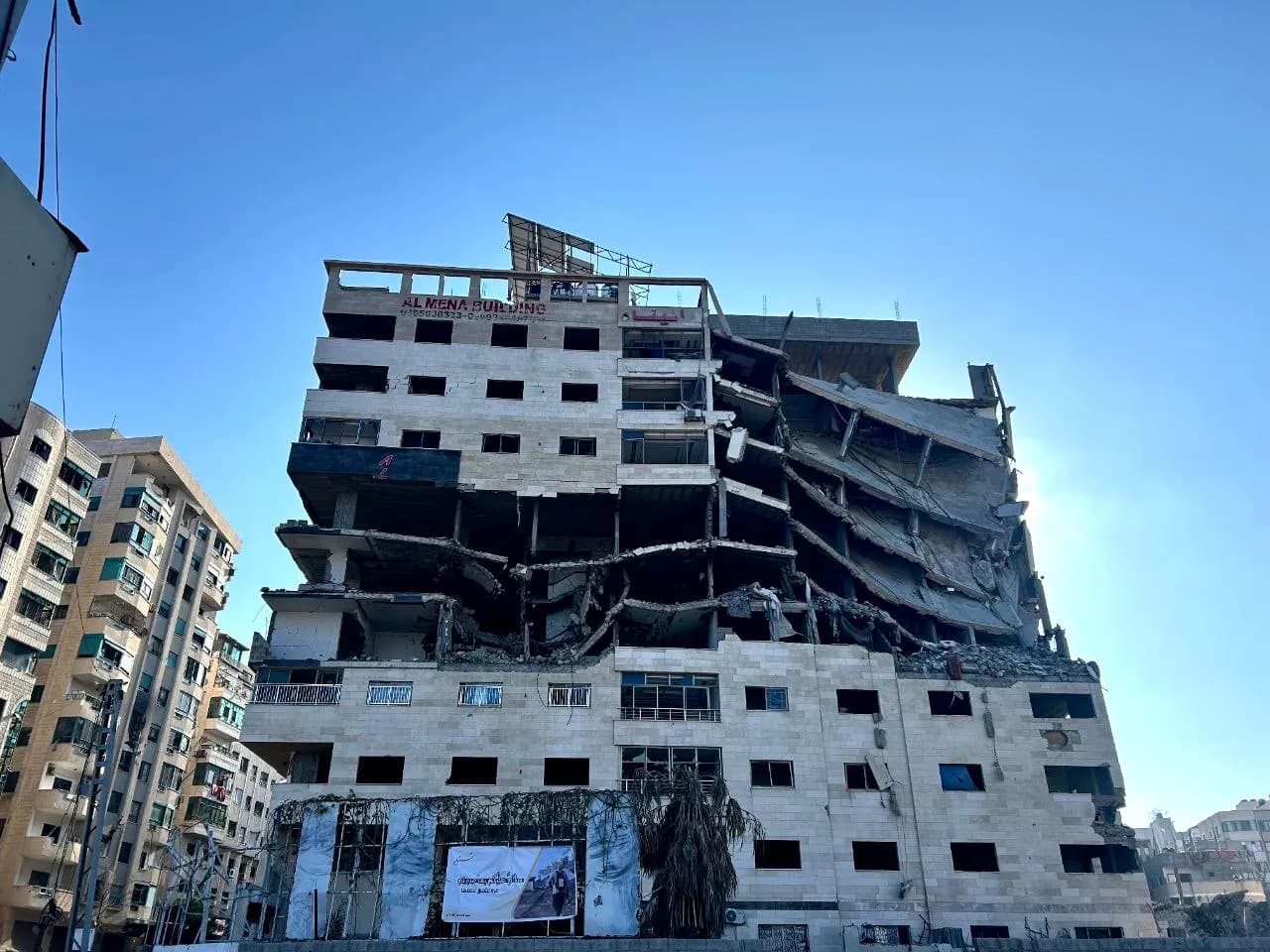 Bombed buildings in Gaza amid rubble and destruction.
