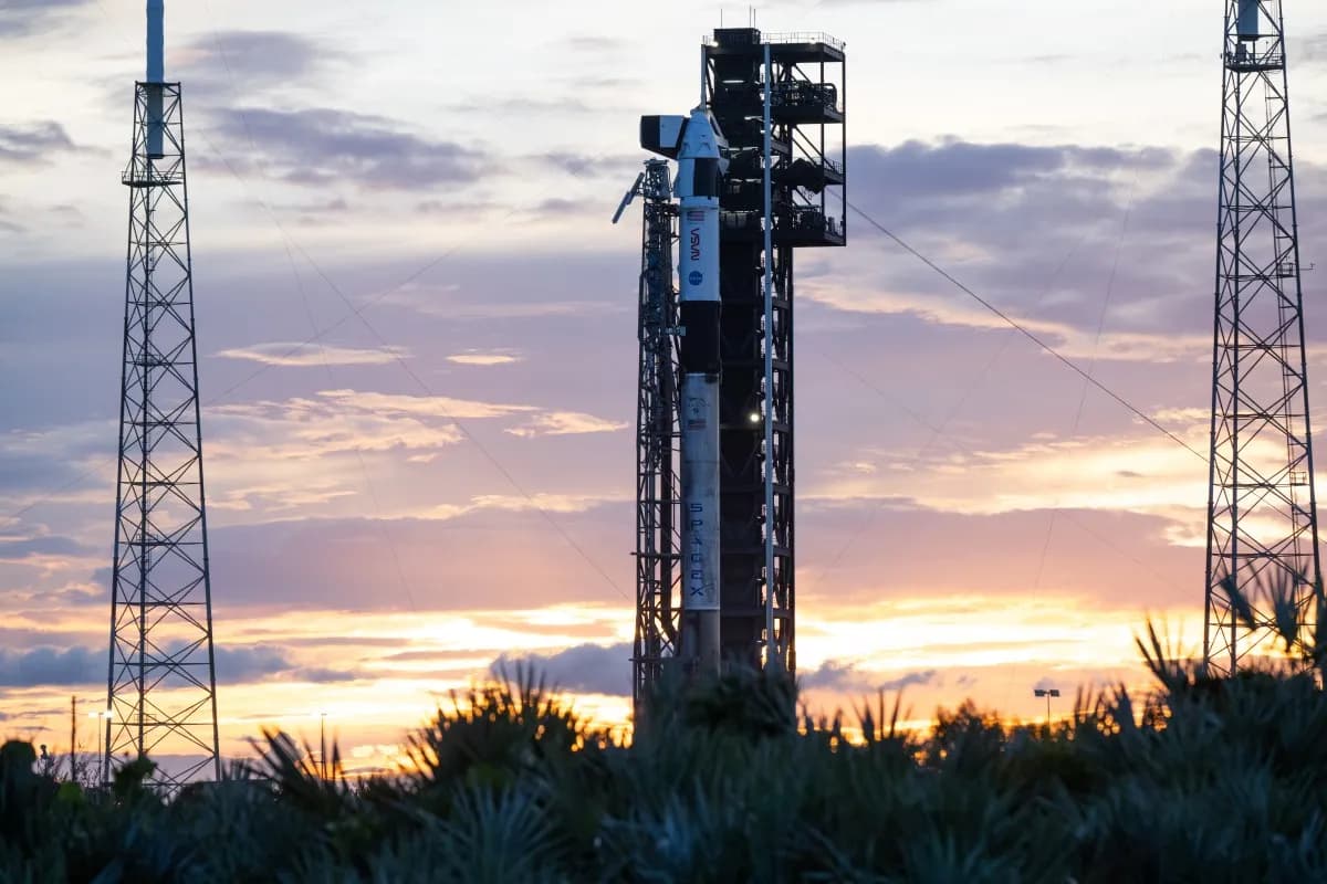 Falcon 9 rocket and Dragon spacecraft on the Crew-13 launch pad at sunset