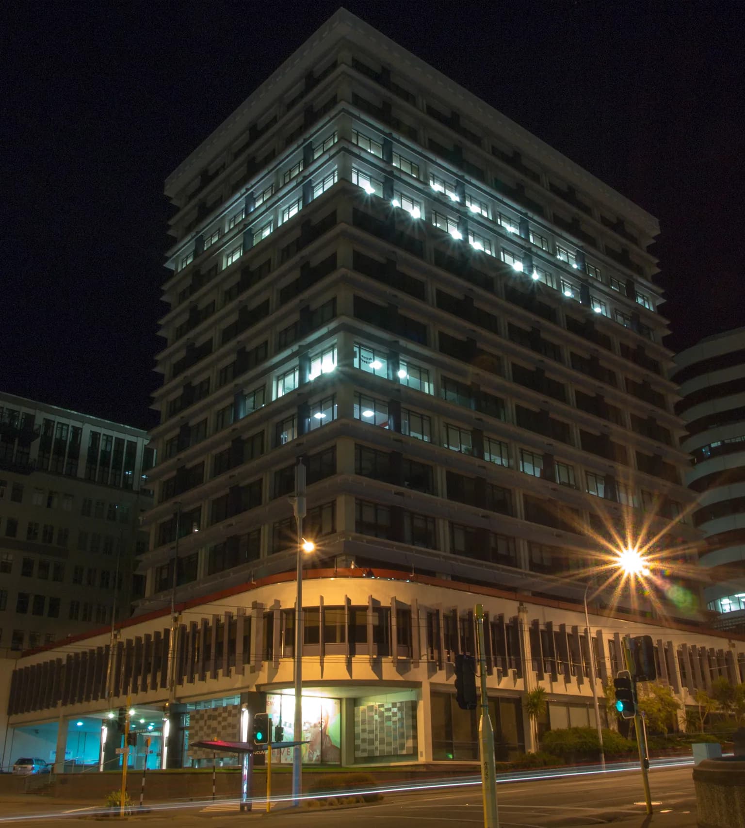 The Reserve Bank of New Zealand building illuminated at night in Wellington.