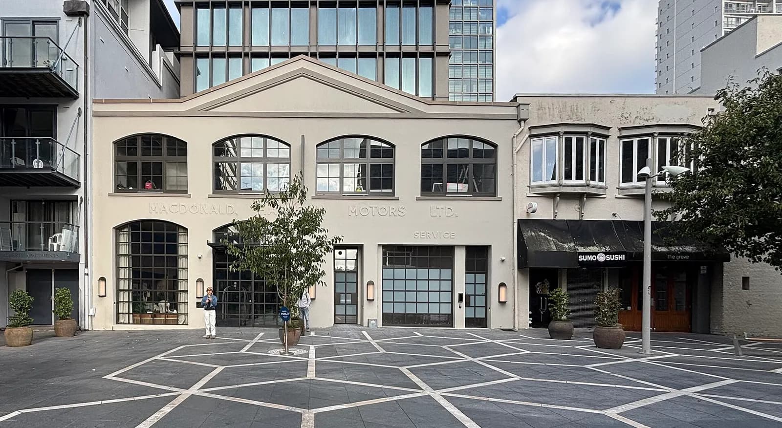 Facade of Hotel Indigo Auckland beside St Patrick’s Square.