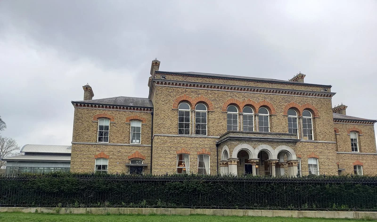The Officers’ Mess building at Garda headquarters in Phoenix Park, Dublin, seen behind a hedge.