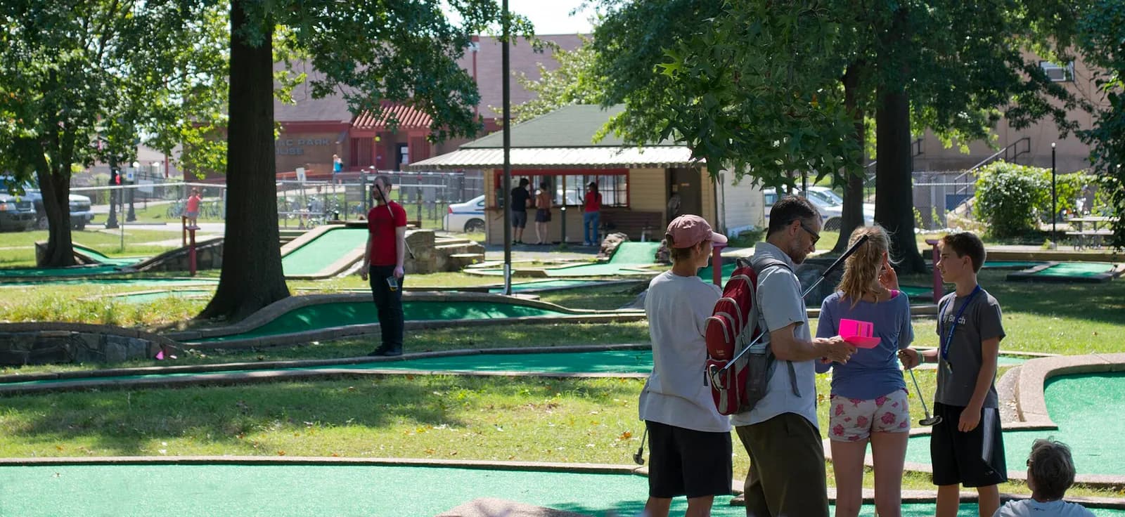 A family plays miniature golf at East Potomac Golf Course in Washington, D.C.