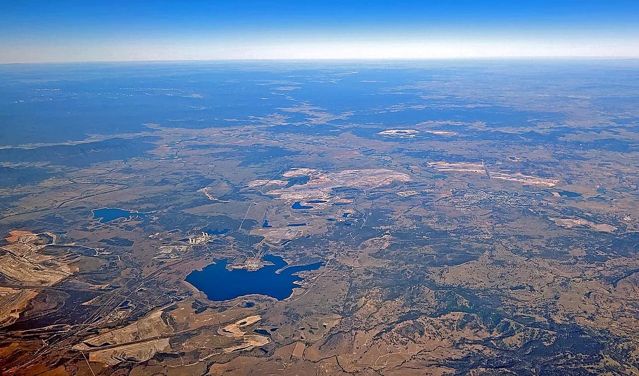 Aerial view of coal mines, a power station and Lake Liddell in New South Wales’ Hunter Valley