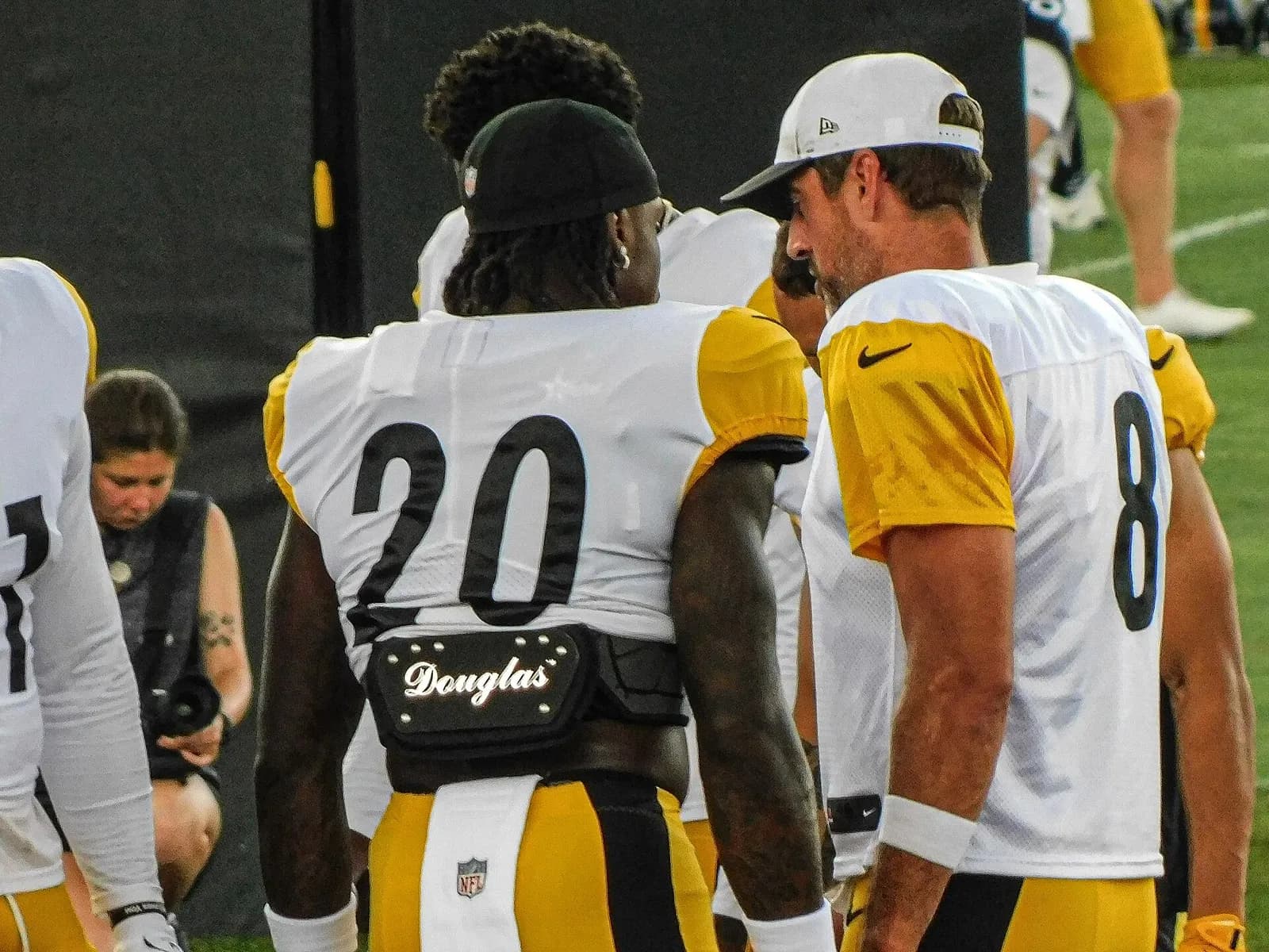 Aaron Rodgers stands with Kaleb Johnson at Steelers training camp.