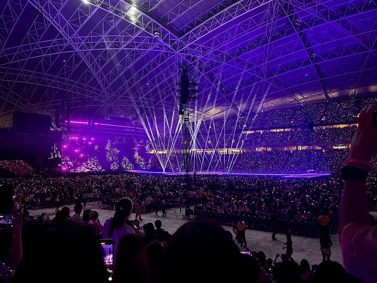 Taylor Swift performing onstage at Singapore National Stadium in March 2024