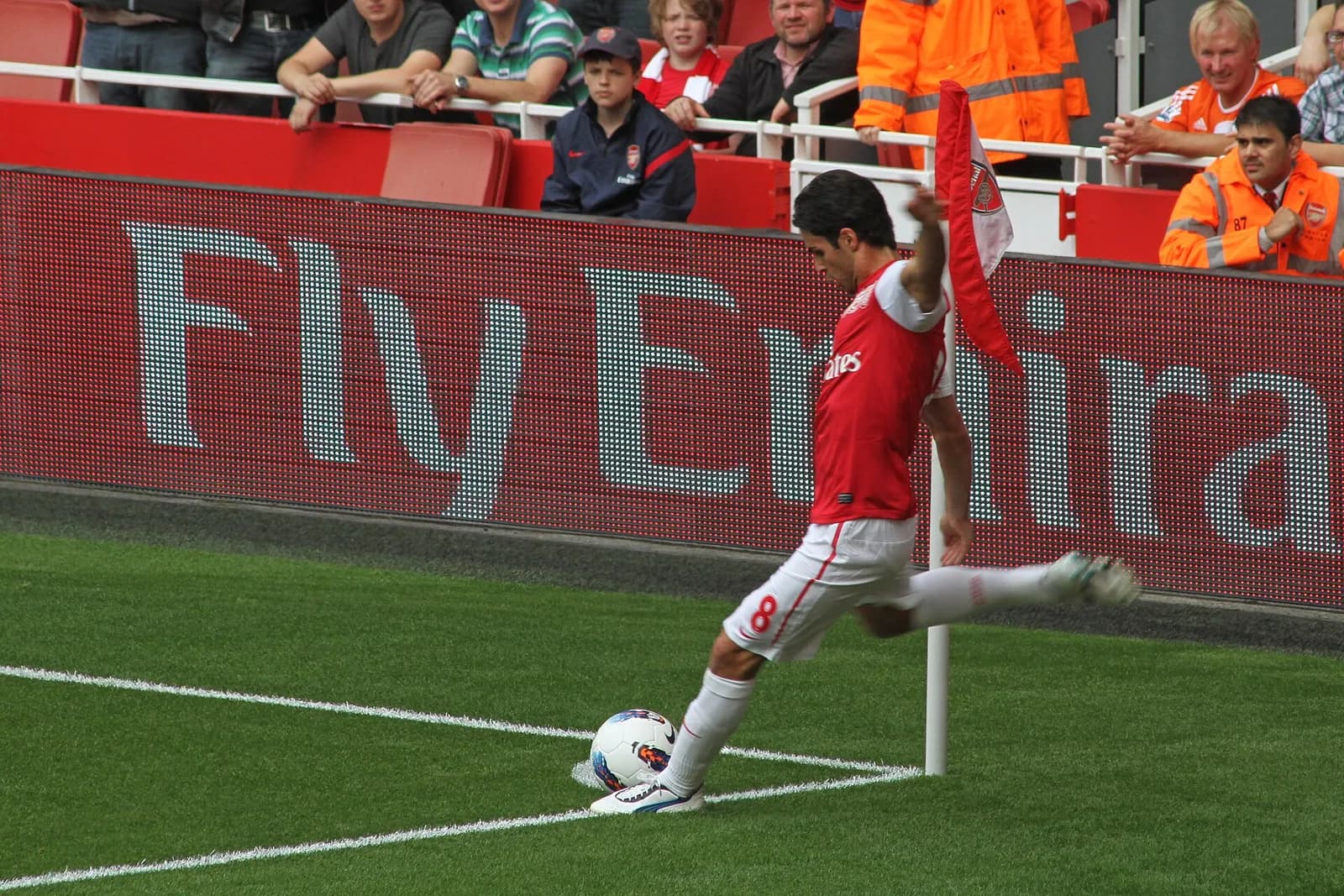 Mikel Arteta in Arsenal kit on the pitch during a match at Emirates Stadium.