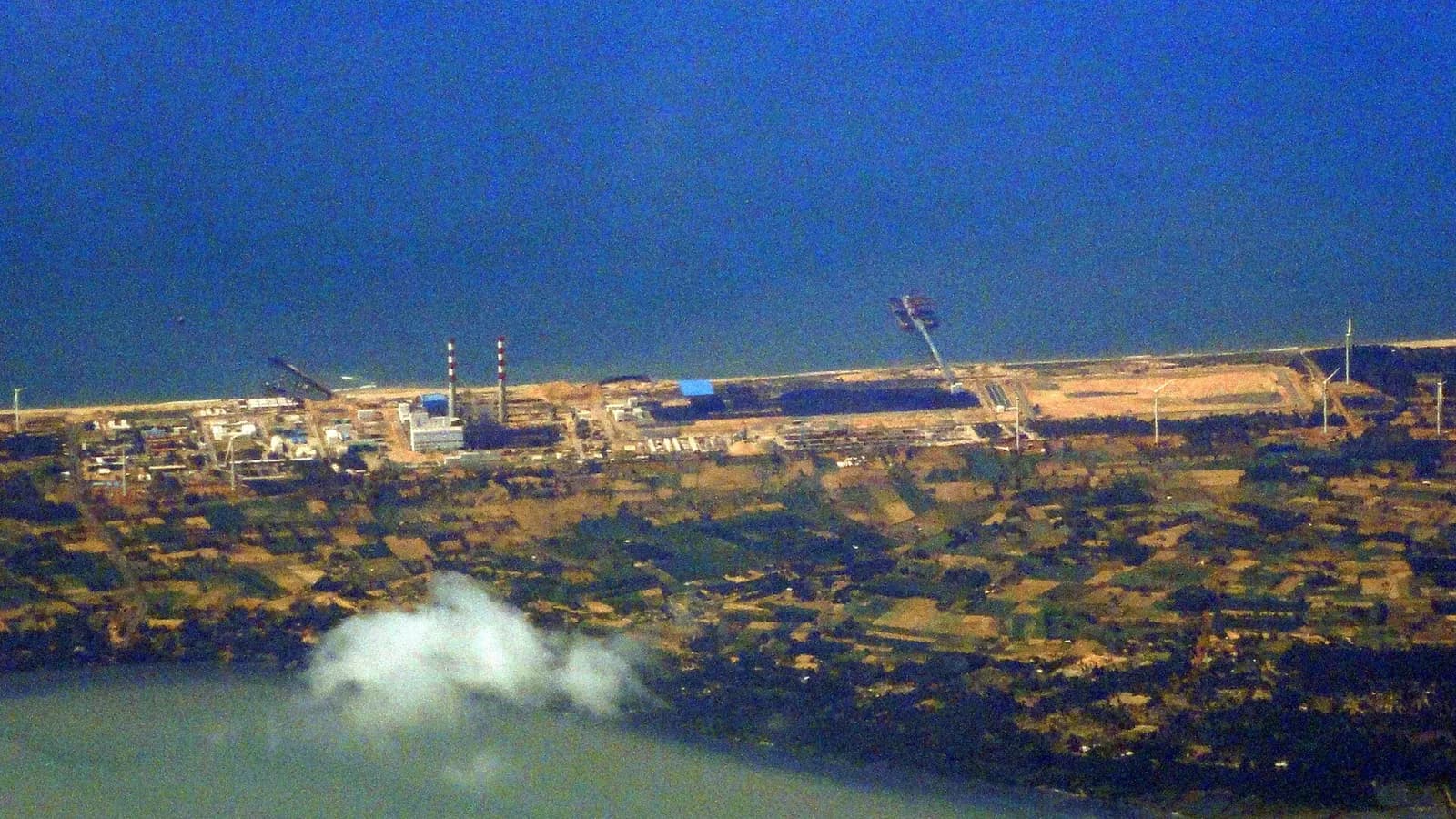 Aerial view of Lakvijaya Power Station among wind turbines in Puttalam District, Sri Lanka.