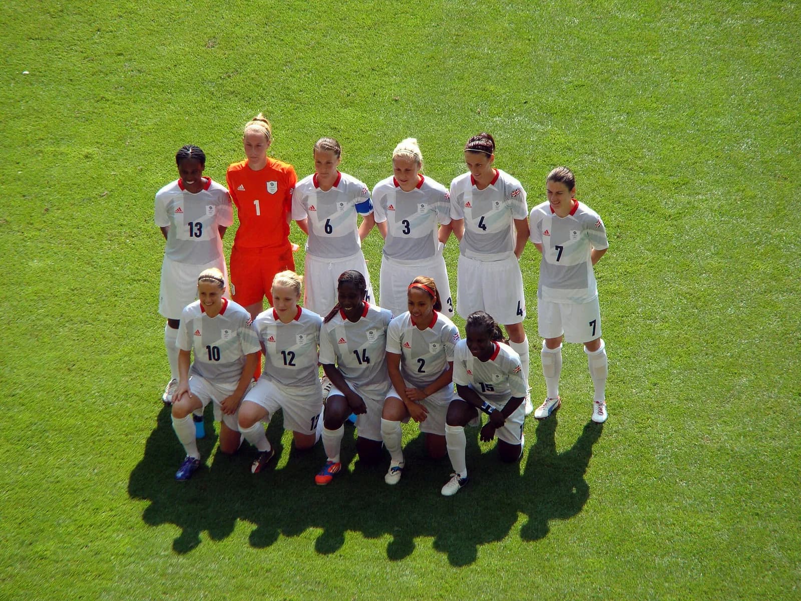 Great Britain women’s football team players pose before an Olympic football match