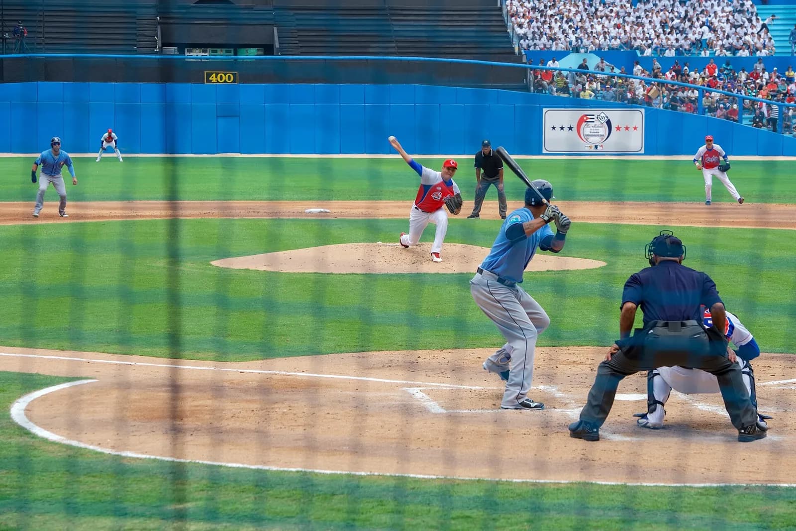 A Cuban National Baseball Team pitcher throws toward a Tampa Bay Rays player during an exhibition game in Havana.