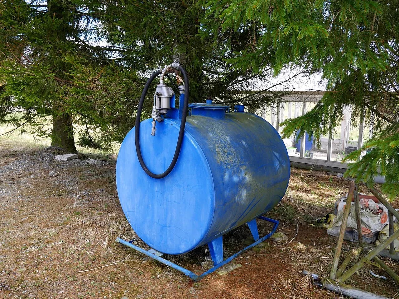 Blue fuel-oil storage tank photographed in Finland in 2017