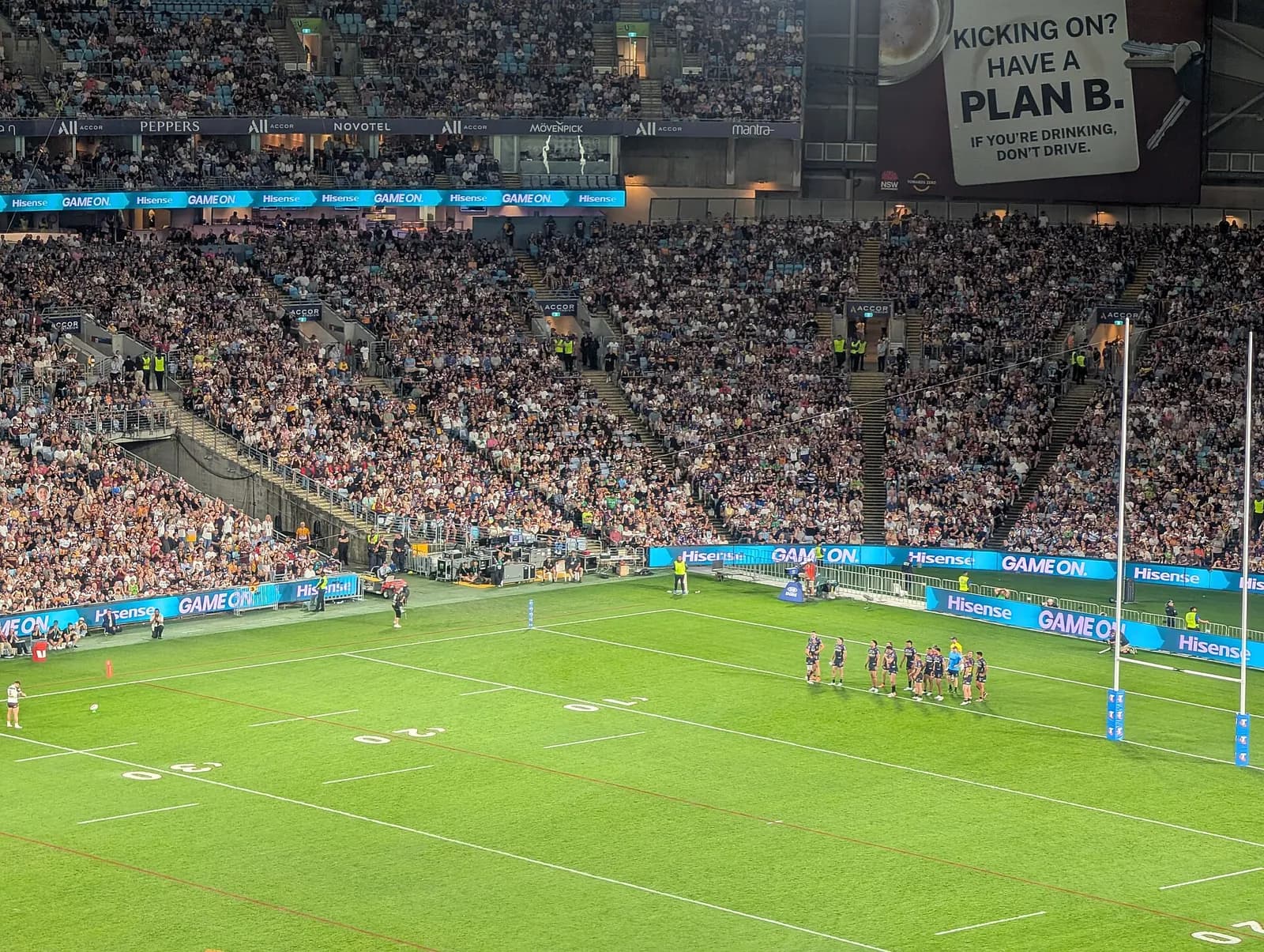 Reece Walsh lines up to attempt a goal conversion in a rugby league match.