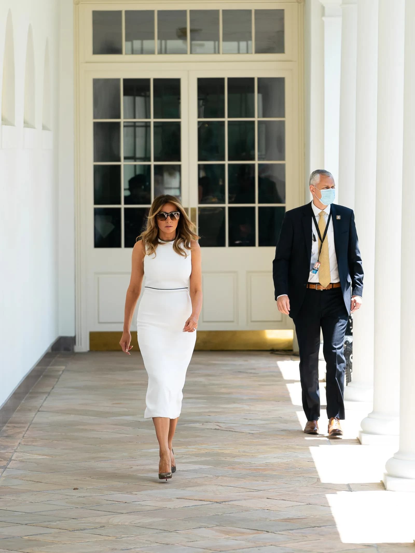 Melania Trump walks along the White House Colonnade.
