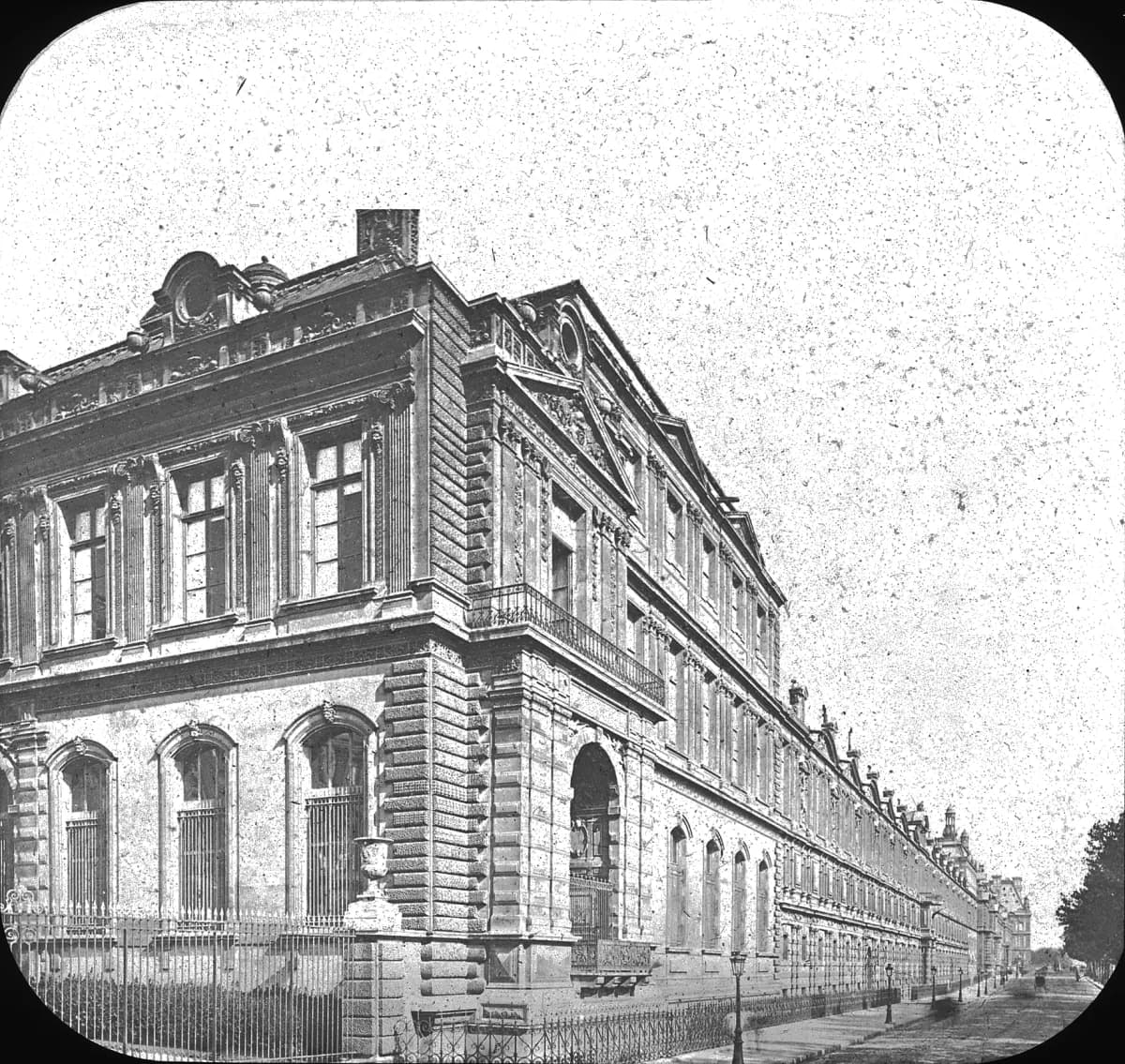Archival photograph of the Louvre exterior in Paris.
