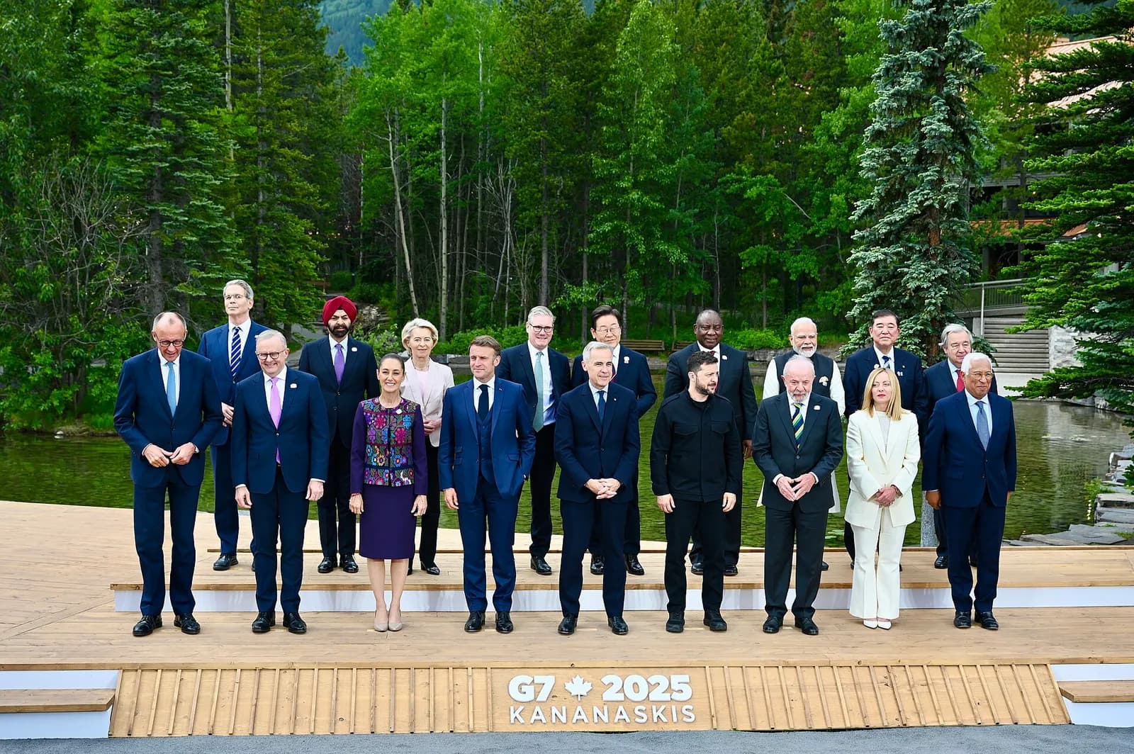 South Korean President Lee Jae Myung and German Chancellor Friedrich Merz stand with other leaders for a group photograph at the G7 summit in Canada.