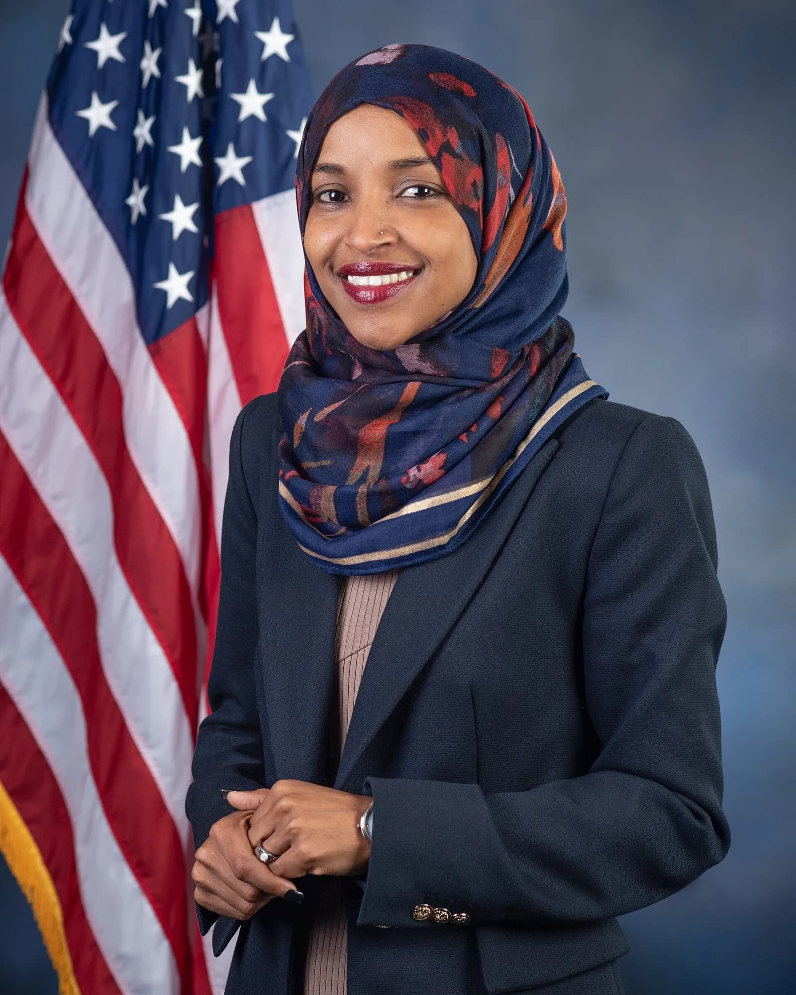 Official portrait of U.S. Representative Ilhan Omar wearing a hijab.