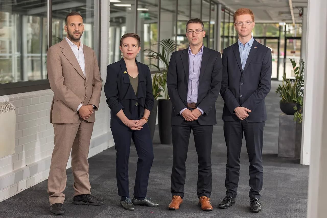 Zack Polanski, Carla Denyer, Adrian Ramsay and Ross Greer standing together in a 2022 group photograph