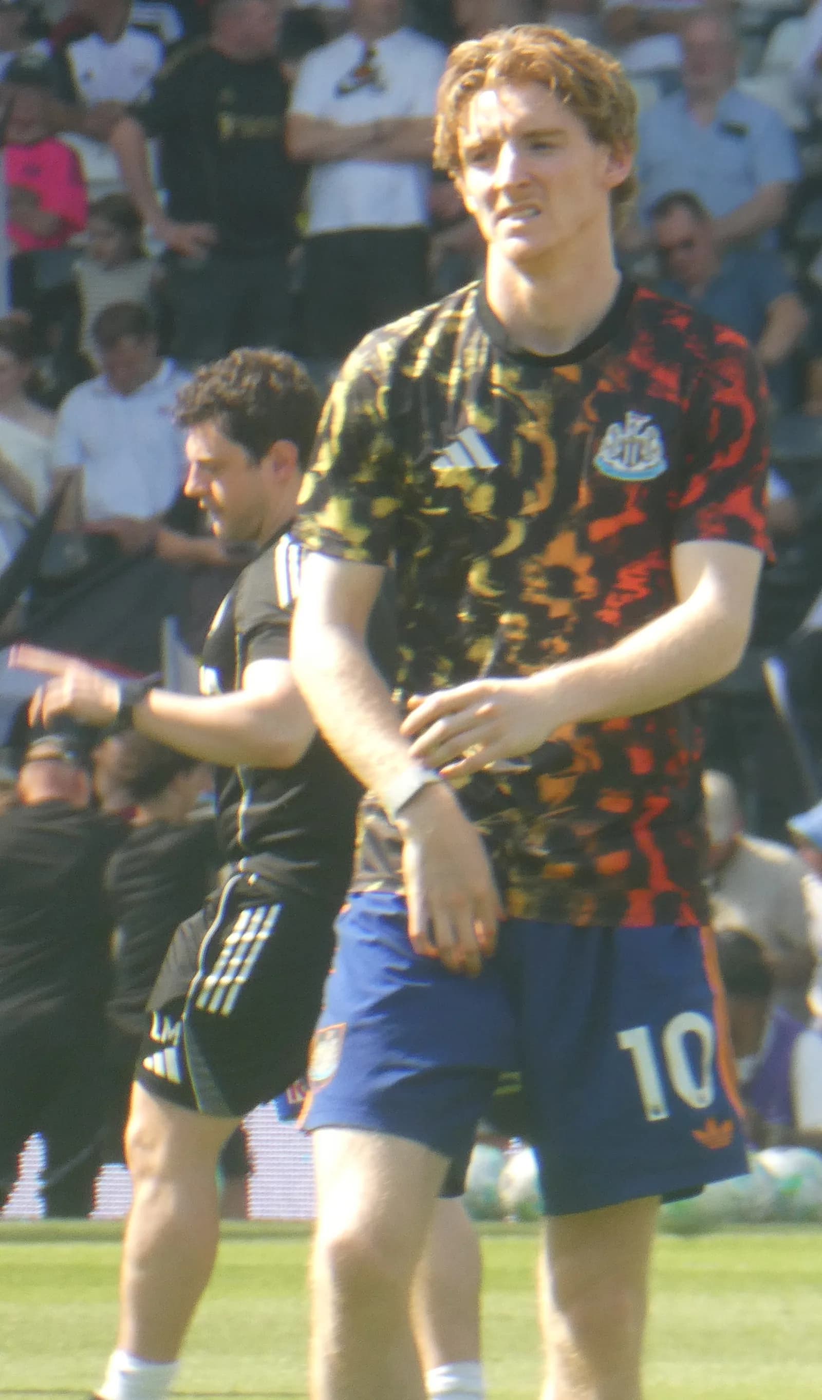 Anthony Gordon warming up before a football match